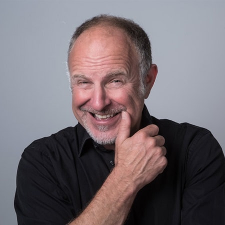 Simon Evans hire English comedian and writer speaker book at agent Great British Speakers...